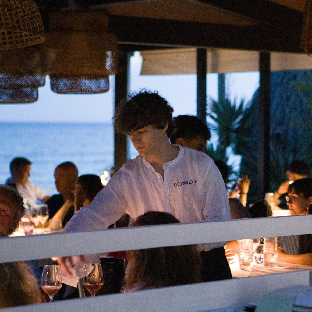 Sunset dinner at Bagno Le Cannucce restaurant with a sea view.